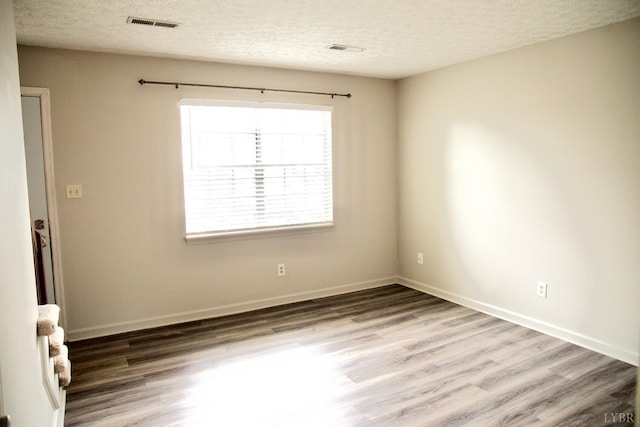 8022 Timberlake Rd Unit 15, Lynchburg, VA 24502 - empty room with wood finished floors, a textured ceiling, and baseboards