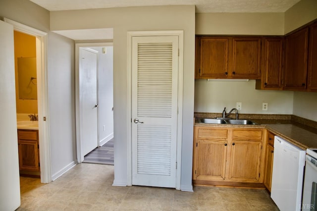 8022 Timberlake Rd Unit 15, Lynchburg, VA 24502 - kitchen with a sink, dishwasher, dark countertops, and baseboards