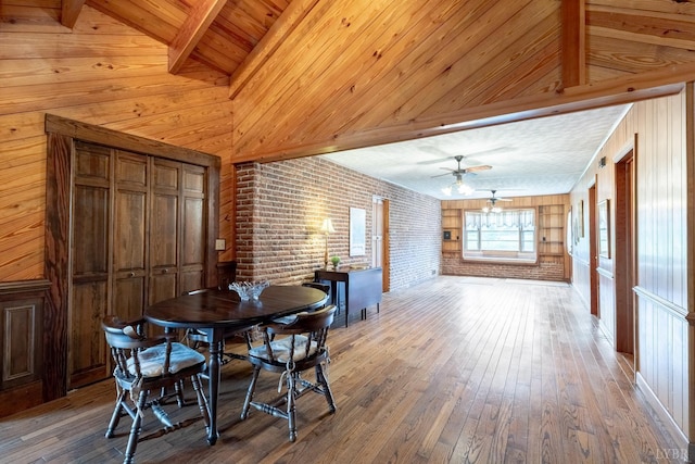 1094 Pigeon Run Rd, Gladys, VA 24554 - dining space with hardwood / wood-style flooring, brick wall, a ceiling fan, wood walls, and wooden ceiling