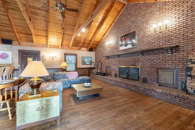 1094 Pigeon Run Rd, Gladys, VA 24554 - living area featuring a brick fireplace, wood ceiling with exposed beams, high vaulted ceiling, wood finished floors, and a ceiling fan