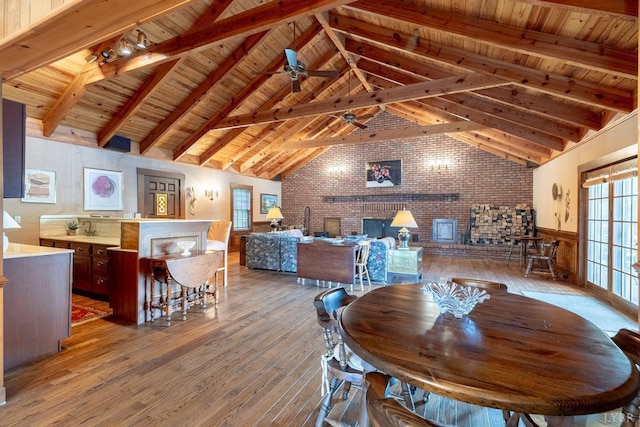 1094 Pigeon Run Rd, Gladys, VA 24554 - dining space featuring brick wall, hardwood / wood-style flooring, wainscoting, ceiling fan, and wooden ceiling