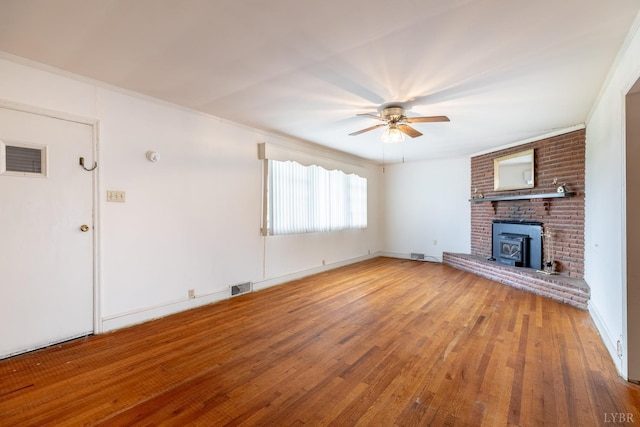 1094 Pigeon Run Rd, Gladys, VA 24554 - unfurnished living room featuring ceiling fan, wood finished floors, and a fireplace