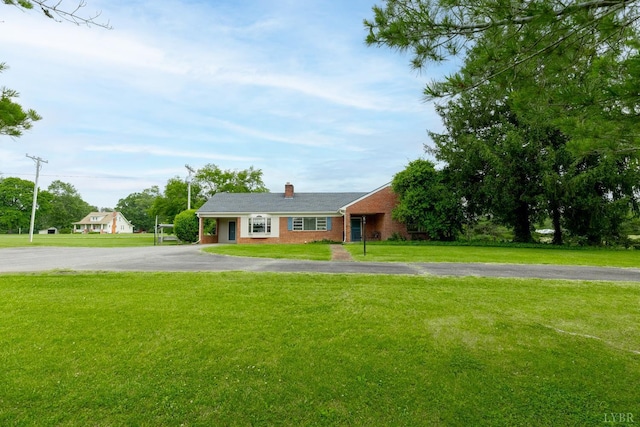 1094 Pigeon Run Rd, Gladys, VA 24554 - ranch-style home with brick siding, a chimney, a front yard, and driveway