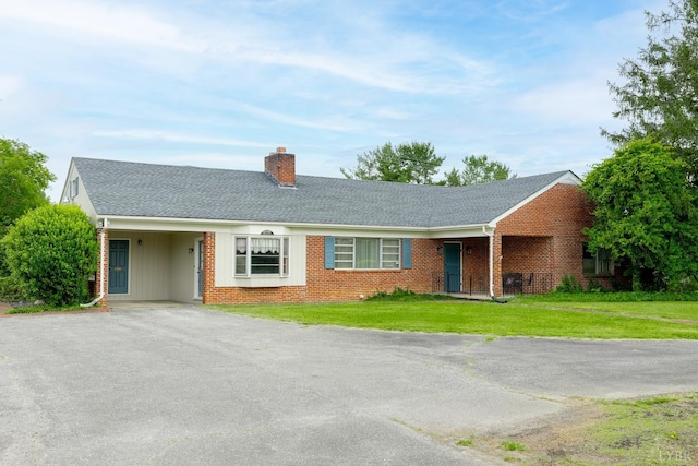 1094 Pigeon Run Rd, Gladys, VA 24554 - ranch-style house featuring a chimney, driveway, a front lawn, and brick siding