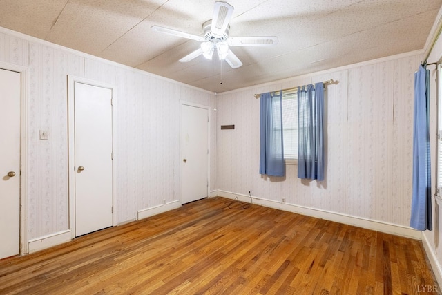 1094 Pigeon Run Rd, Gladys, VA 24554 - unfurnished bedroom featuring hardwood / wood-style floors, ornamental molding, ceiling fan, and baseboards