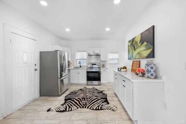 1004 Buchanan, Lynchburg, VA 24501 - kitchen with appliances with stainless steel finishes, light countertops, white cabinetry, recessed lighting, and a sink
