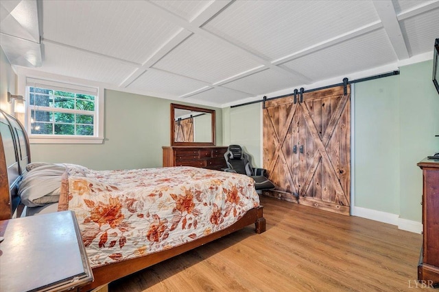 909 Lake Dr, Bedford, VA 24523 - bedroom featuring wood finished floors, coffered ceiling, a barn door, and baseboards