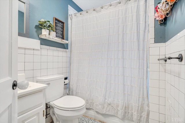 909 Lake Dr, Bedford, VA 24523 - bathroom with tile walls, vanity, and toilet