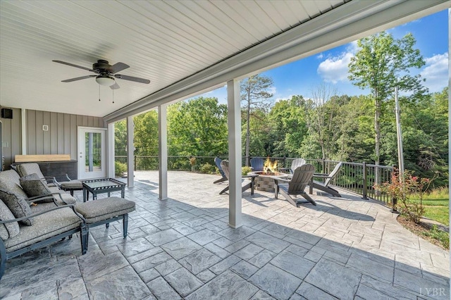 1620 Stripers Cove Rd, Goodview, VA 24095 - view of patio / terrace featuring a fire pit, ceiling fan, and french doors