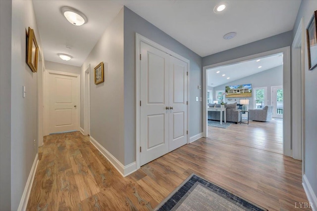 1620 Stripers Cove Rd, Goodview, VA 24095 - hallway featuring wood finished floors, vaulted ceiling, and recessed lighting