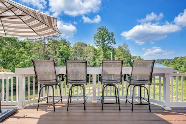 1620 Stripers Cove Rd, Goodview, VA 24095 - wooden deck featuring outdoor dining area and view of scattered trees