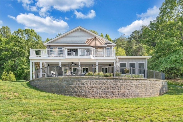 1620 Stripers Cove Rd, Goodview, VA 24095 - back of property featuring a lawn, a ceiling fan, board and batten siding, and a deck