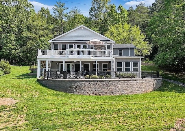 1620 Stripers Cove Rd, Goodview, VA 24095 - back of house featuring a wooden deck, a yard, and a forest view