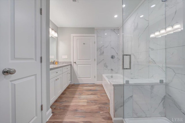 1620 Stripers Cove Rd, Goodview, VA 24095 - bathroom featuring a marble finish shower, vanity, wood finished floors, recessed lighting, and a bathtub