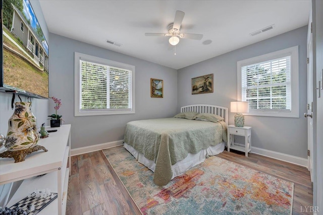 1620 Stripers Cove Rd, Goodview, VA 24095 - bedroom with baseboards, wood finished floors, and a ceiling fan