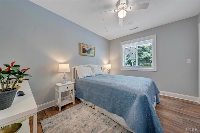 1620 Stripers Cove Rd, Goodview, VA 24095 - bedroom with wood finished floors, baseboards, and ceiling fan