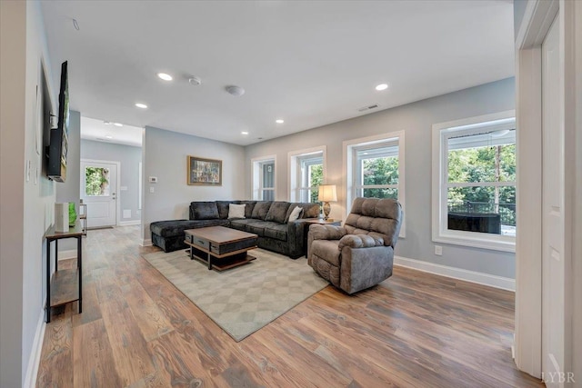 1620 Stripers Cove Rd, Goodview, VA 24095 - living room featuring wood finished floors, baseboards, and recessed lighting