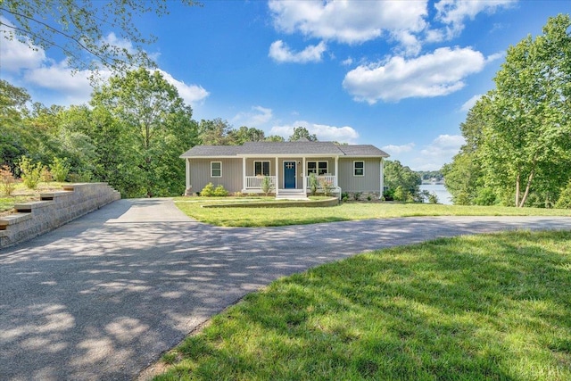 1620 Stripers Cove Rd, Goodview, VA 24095 - ranch-style house with a porch, asphalt driveway, and a front lawn