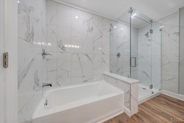1620 Stripers Cove Rd, Goodview, VA 24095 - bathroom featuring a bath, a marble finish shower, and wood finished floors