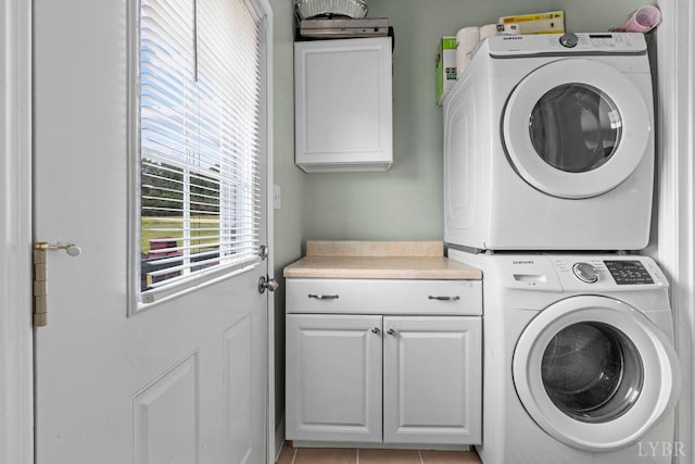 4710 Hummingbird Ln, Concord, VA 24538 - washroom featuring stacked washing machine and dryer and cabinet space