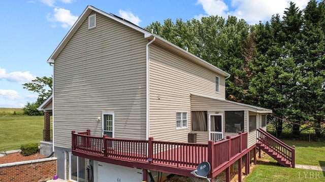 4710 Hummingbird Ln, Concord, VA 24538 - rear view of property with a sunroom, a deck, a garage, a lawn, and stairway