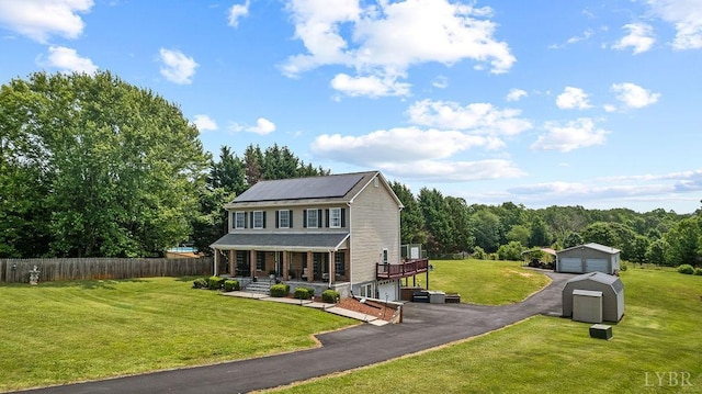 4710 Hummingbird Ln, Concord, VA 24538 - view of front of property featuring covered porch, a garage, and solar panels