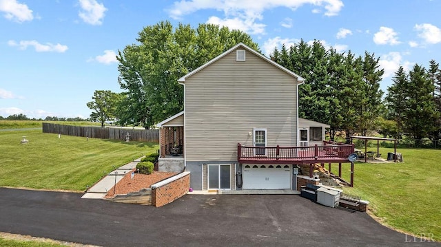4710 Hummingbird Ln, Concord, VA 24538 - view of property exterior with a deck, asphalt driveway, and an attached garage