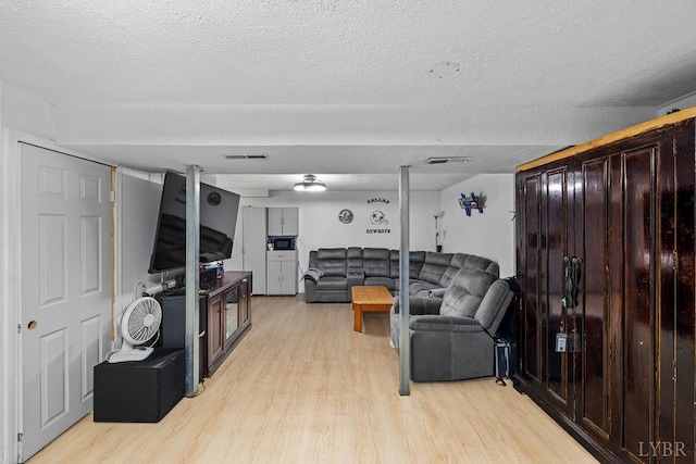4710 Hummingbird Ln, Concord, VA 24538 - living area with light wood finished floors and a textured ceiling