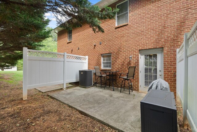 824 Wiggington Rd Unit 303, Lynchburg, VA 24502 - view of patio with central air condition unit and outdoor dining space