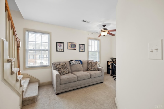 824 Wiggington Rd Unit 303, Lynchburg, VA 24502 - living area featuring stairway, light colored carpet, ceiling fan, and baseboards