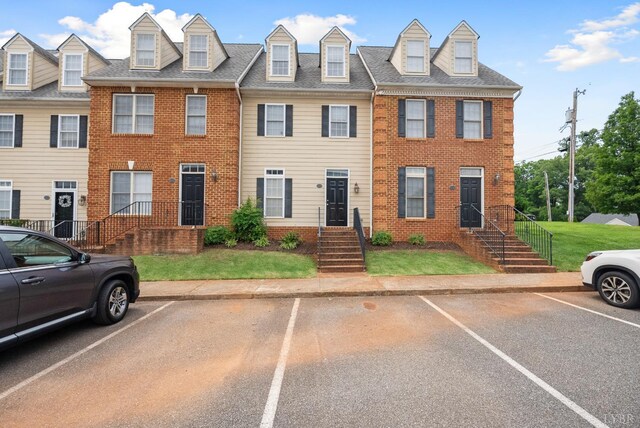 824 Wiggington Rd Unit 303, Lynchburg, VA 24502 - multi unit property with uncovered parking, brick siding, and a front lawn