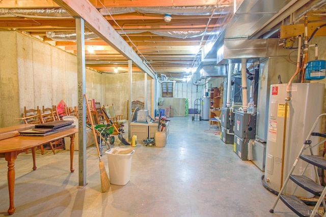 unfinished below grade area featuring water heater