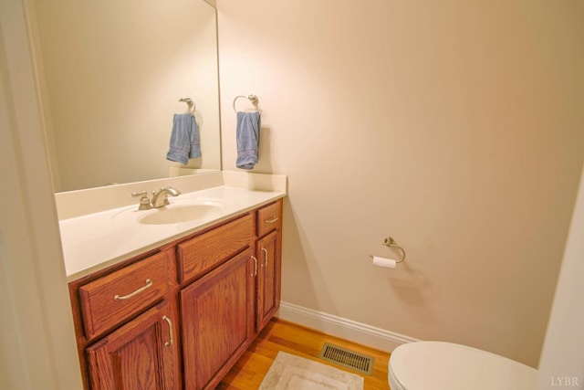 bathroom featuring vanity and wood finished floors