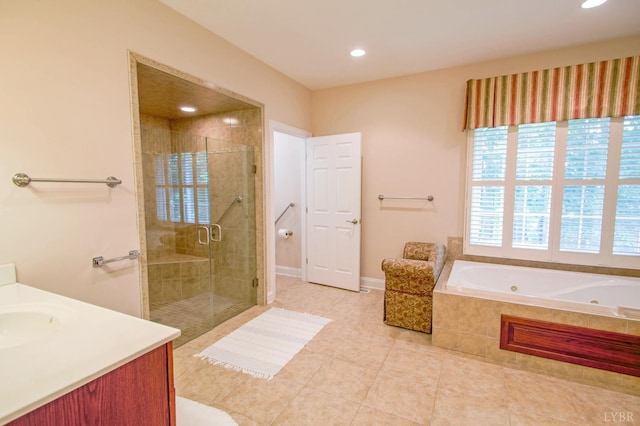bathroom featuring a tub with jets, a stall shower, tile patterned flooring, vanity, and recessed lighting