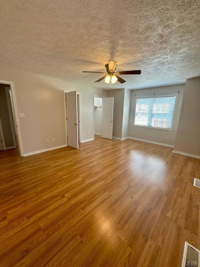 511 Bent Oak Ct, Lynchburg, VA 24502 - spare room featuring ceiling fan, a textured ceiling, and wood finished floors