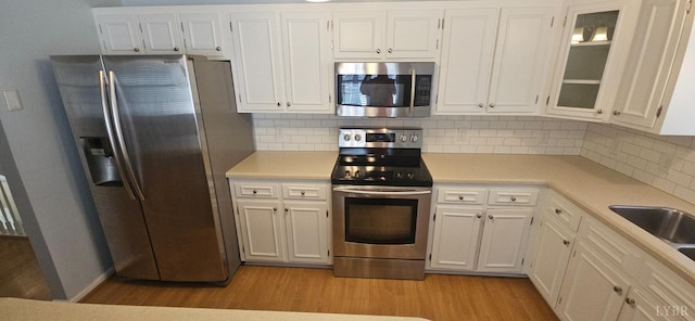511 Bent Oak Ct, Lynchburg, VA 24502 - kitchen featuring stainless steel appliances, light wood-style floors, light countertops, and white cabinetry