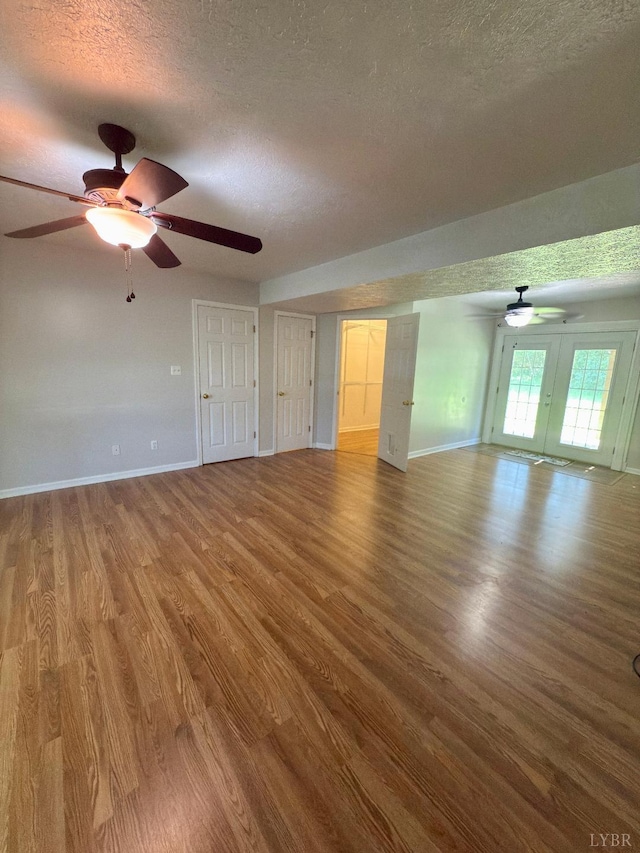 511 Bent Oak Ct, Lynchburg, VA 24502 - unfurnished living room featuring a textured ceiling, wood finished floors, and a ceiling fan