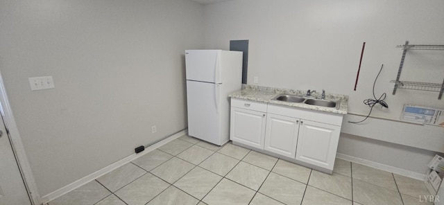 511 Bent Oak Ct, Lynchburg, VA 24502 - kitchen with freestanding refrigerator, light countertops, white cabinetry, and light tile patterned flooring