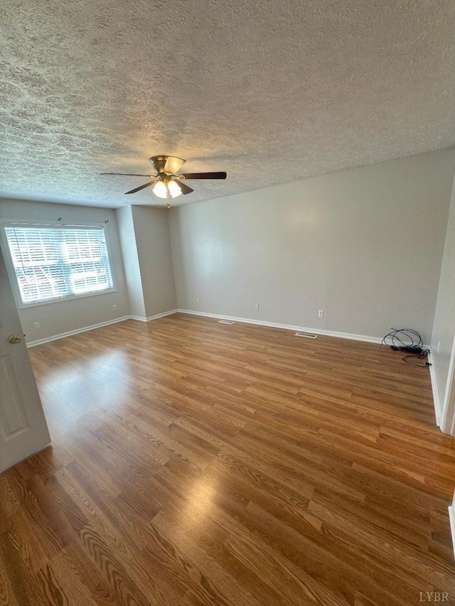 511 Bent Oak Ct, Lynchburg, VA 24502 - spare room featuring ceiling fan, wood finished floors, and a textured ceiling