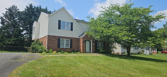 511 Bent Oak Ct, Lynchburg, VA 24502 - view of front of home with brick siding, a front yard, and asphalt driveway