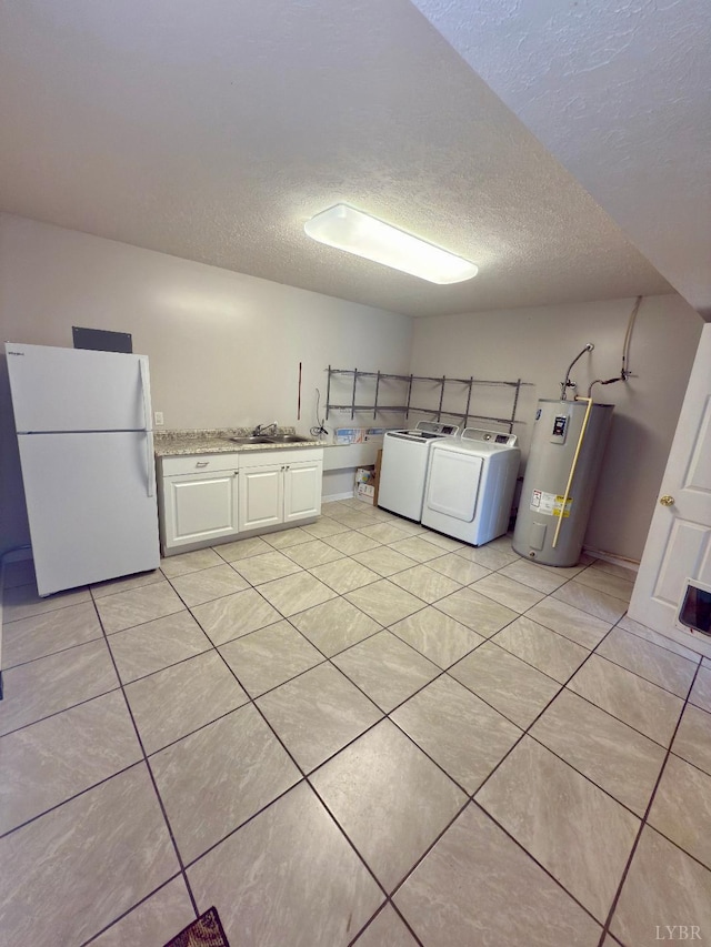 511 Bent Oak Ct, Lynchburg, VA 24502 - washroom with cabinet space, electric water heater, a textured ceiling, independent washer and dryer, and light tile patterned floors
