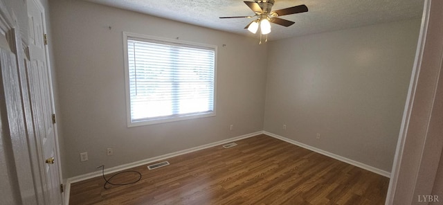 511 Bent Oak Ct, Lynchburg, VA 24502 - spare room featuring healthy amount of natural light, dark wood finished floors, a textured ceiling, and a ceiling fan