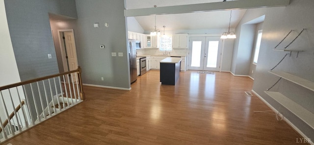 511 Bent Oak Ct, Lynchburg, VA 24502 - kitchen with a chandelier, light wood-style floors, white cabinets, a center island, and light countertops