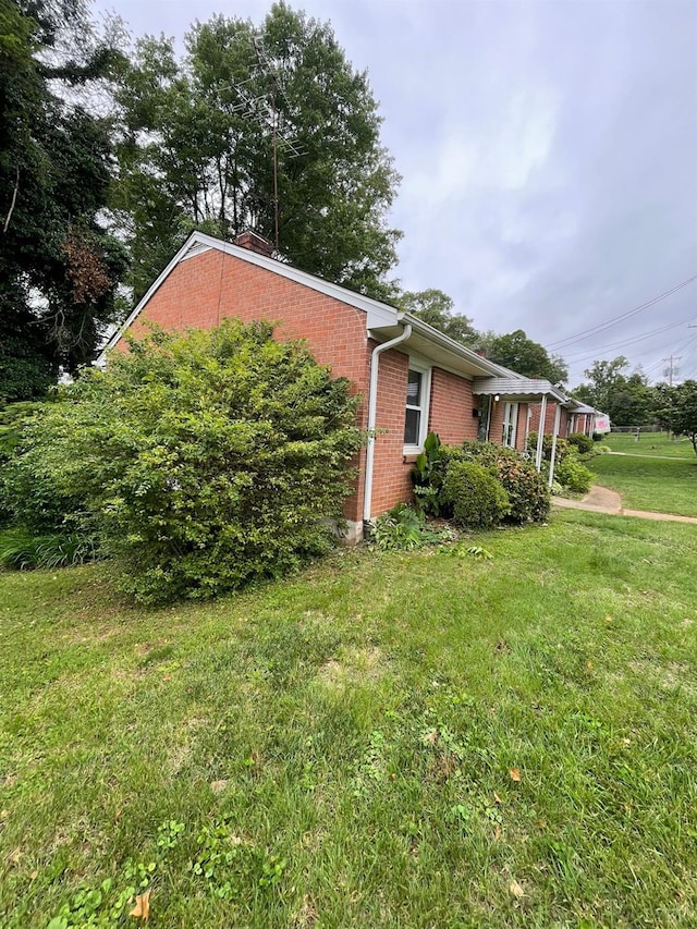 609 Hood St, Lynchburg, VA 24501 - view of property exterior featuring brick siding and a lawn