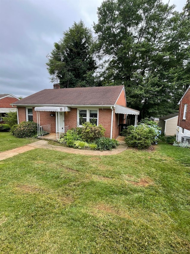 609 Hood St, Lynchburg, VA 24501 - ranch-style house featuring brick siding, a front yard, and a chimney