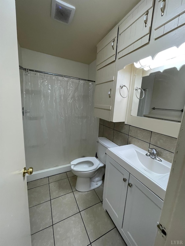 609 Hood St, Lynchburg, VA 24501 - full bathroom with toilet, vanity, tile patterned flooring, a shower with shower curtain, and decorative backsplash