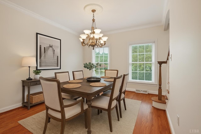 103 Waterton Dr, Lynchburg, VA 24503 - dining space with a chandelier, crown molding, and light wood-style floors