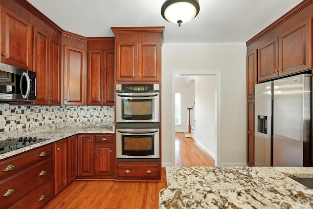 103 Waterton Dr, Lynchburg, VA 24503 - kitchen with stainless steel appliances, light wood-style floors, light stone counters, tasteful backsplash, and crown molding
