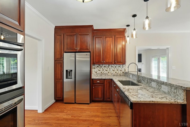 103 Waterton Dr, Lynchburg, VA 24503 - kitchen with stainless steel appliances, light wood-type flooring, a peninsula, ornamental molding, and light stone countertops