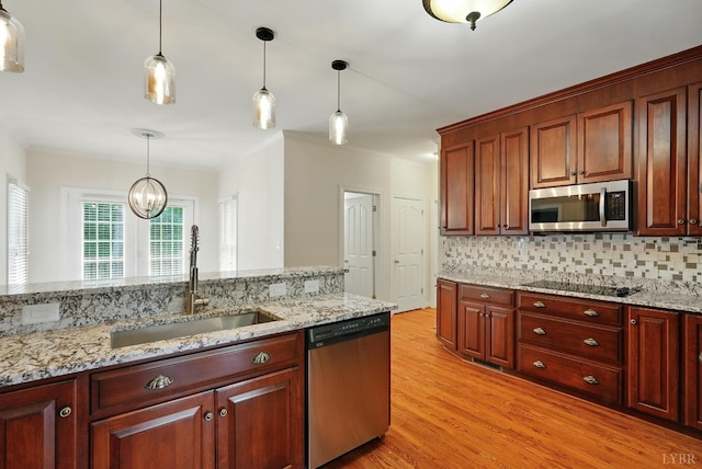 103 Waterton Dr, Lynchburg, VA 24503 - kitchen featuring stainless steel appliances, decorative light fixtures, backsplash, light wood finished floors, and crown molding